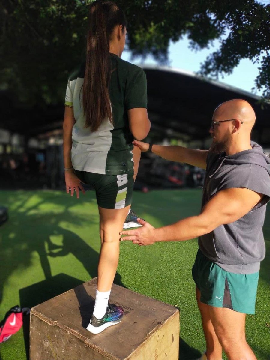 “Fitness trainer in Marbella motivating clients to push past their fitness limits.”