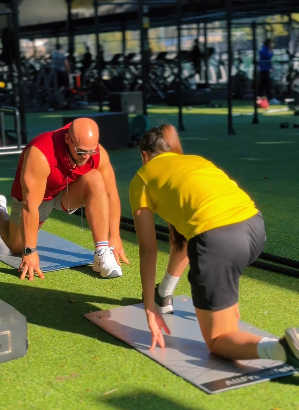 "Personal trainer in Marbella helping client to improve her mobility."